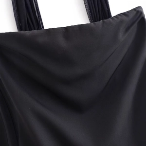 Black satin tube dress with elegant ruffled tulle straps and smooth silk texture