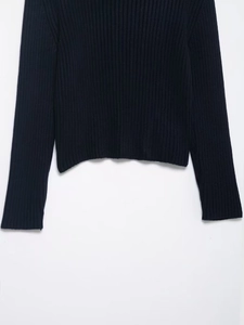 Detailed view of the ribbed knit texture and stitching on this navy long sleeve cardigan