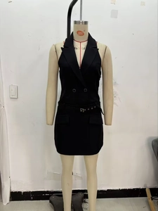 Detail of black halter neck mini blazer dress with double-breasted buttons and waist belt