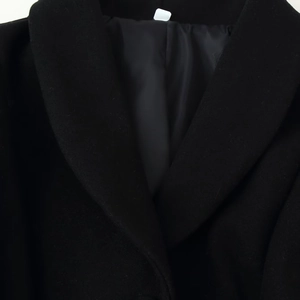 Classic black wool overcoat featuring a sophisticated lapel design and button closure
