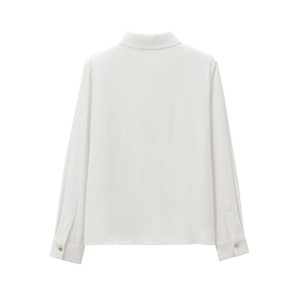 Elegant white long sleeve crepe blouse for women with padded shoulders and gold button cuffs