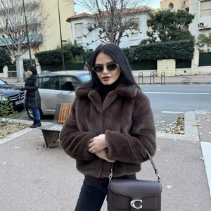 Chic dark brown faux fur short coat with wide collar for women in winter street style