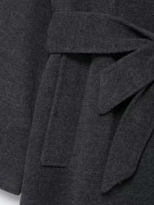 Macro detail of dark grey high-density wool blend coat with waist belt and twill texture