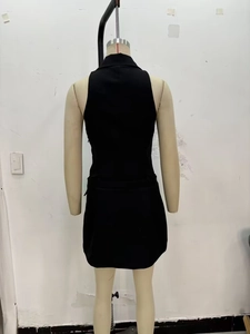 Slim fit black sleeveless blazer dress showing the back view on a mannequin stand