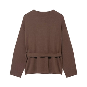 Close-up detail of dark brown knit coat fabric texture and integrated matching waist belt