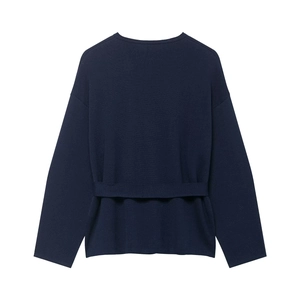 Detail view of navy blue knit coat back featuring a horizontal waist strap and dropped shoulders