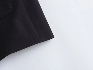 Macro view of high-quality black woven fabric with precise stitching and fine texture