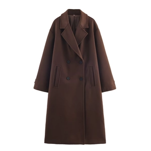 Detail of dark brown double-breasted wool blend coat with notch lapel and four black buttons