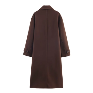 Detail view of the back of a dark brown long wool blend coat with cuff straps and rear seam