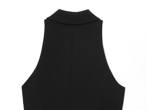 Close-up of rear neckline and shoulder stitching on a structured black blazer dress