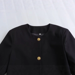 Classic black round neck tweed jacket featuring decorative gold textured buttons