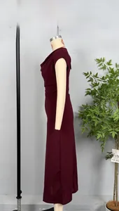 Detail of elegant wine red sleeveless dress showing the gathered waist and draped neck