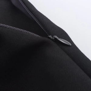 Contrast waist skort with invisible zipper detail on textured black fabric