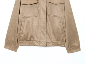 Detail of khaki faux suede jacket showing flap chest pockets and elasticated hem