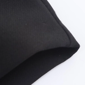 Close-up of the professional hemmed edge and fabric texture on black skort shorts