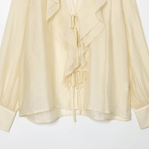 Elegant cream ruffled V-neck chiffon blouse for women featuring long sleeves and tie neck