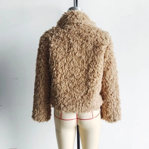 Detail view of the plush teddy faux fur texture on this cropped brown winter jacket