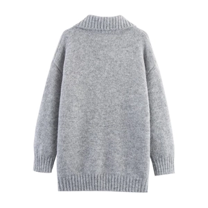 Loose fit grey knit sweater with half-zip collar and ribbed texture on white background