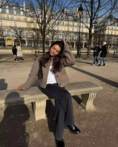 Outdoor shot of a brown wool blend cropped jacket with black wide-leg jeans and shoes