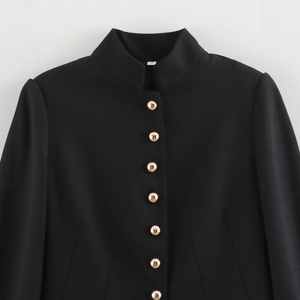 Women's black stand collar blazer jacket with gold buttons and subtle textured fabric