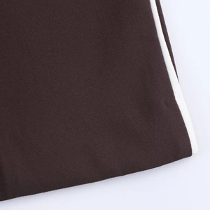 Dark brown straight leg trousers with white side stripe detailing and woven texture