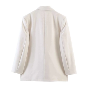 Back view of cream double-breasted blazer showing clean tailoring and center seam detail