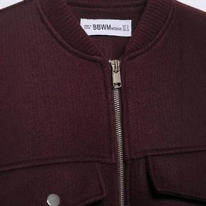 Women's dark red wool short jacket with silver metal zipper and ribbed knit collar detail