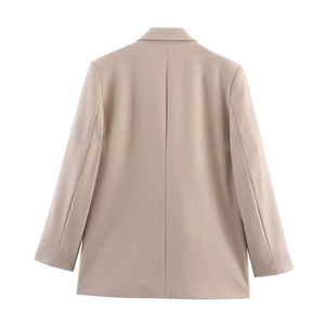 Rear view of a beige oversized double-breasted blazer showing tailoring and back seam