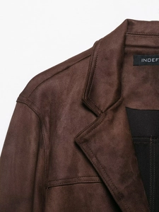 Detail of faux suede jacket in dark coffee color showing collar and shoulder stitching