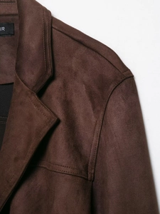 Close-up detail of dark brown faux suede jacket collar and fabric texture with belt