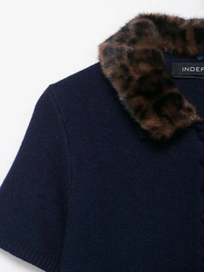 Detail shot of navy knit cardigan with brown leopard print faux fur collar and brand label