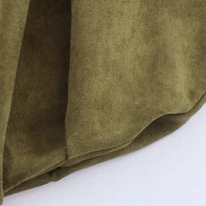 Detail of olive green faux suede texture with smooth satin lining on bomber jacket