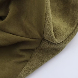 Detail of olive green flight jacket featuring mixed faux suede and smooth fabric textures