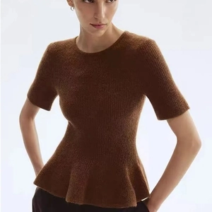 Women's minimalist dark brown short sleeve knit top with peplum hem and ribbed texture