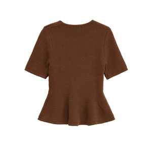 Detail of the peplum hem and ribbed texture on this dark brown short-sleeve knit top