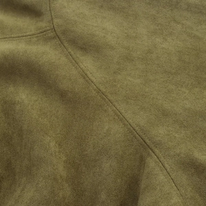 Close-up of olive green faux suede fabric with precise double stitching details