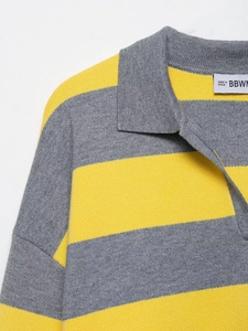 Close-up of the striped knit Polo collar and soft texture of the gray and yellow sweater