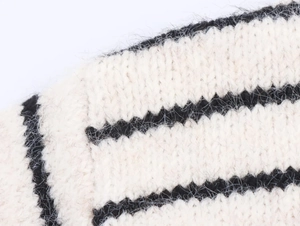 Detailed close-up of striped fuzzy knit fabric showing premium soft hairy texture