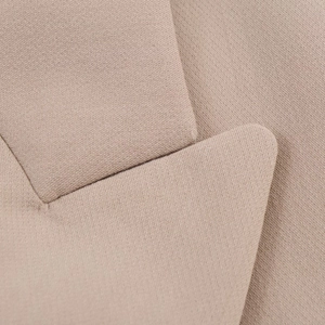 Macro view of khaki blazer notch lapel showing premium textured woven fabric details