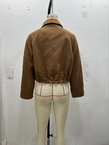 Back view of a cropped brown faux suede jacket with elasticated hem and raglan sleeves