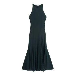 Detailed view of dark green sleeveless halter dress with elegant pleated fishtail hem