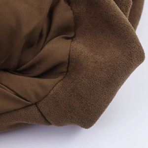 Detail of coffee brown faux suede fabric and smooth inner lining on the aviator jacket