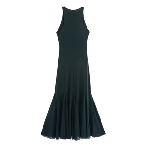 Detail of dark green sleeveless maxi dress featuring a mesh overlay and fishtail hemline