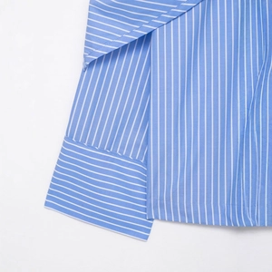Blue and white vertical striped long sleeve shirt showing cuff detail and fabric texture