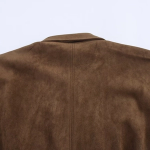 Detail of double-needle stitching on the back seam of a dark brown faux suede jacket