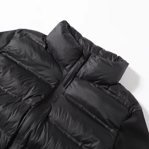 Doudoune matelassée noire pour femme avec col montant et détails de manches en tricot