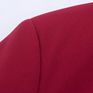Macro shot of precise shoulder seam stitching on this deep red oversized blazer jacket