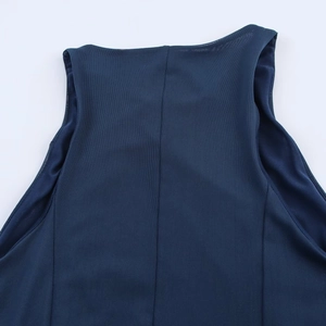 Detail of dark blue sleeveless mesh dress showing fine breathable texture and stitching