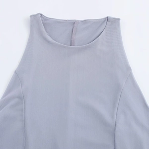 Detailed macro view of the round neckline and mesh fabric on a sleeveless dress