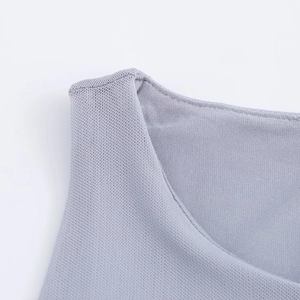 Close-up detail of the crew neckline and fine grey mesh fabric texture on this dress